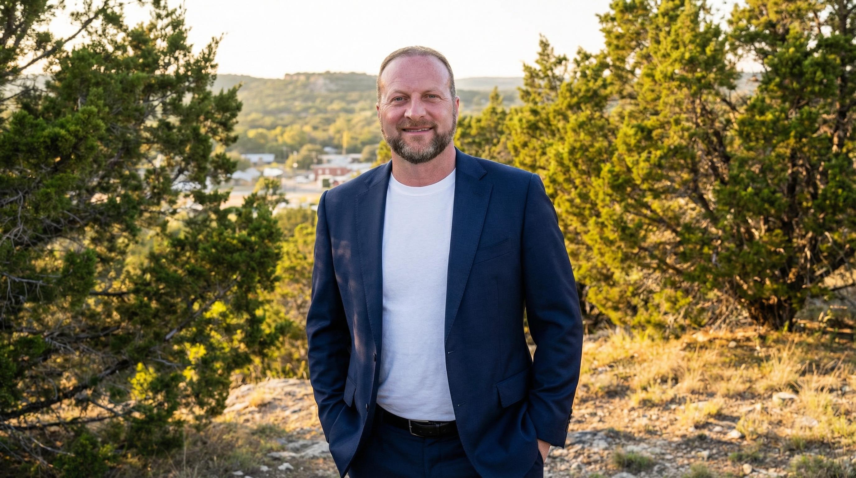 Christopher Beal, veteran REALTOR, in the Texas Hill Country near Helotes with cedar trees and limestone hills